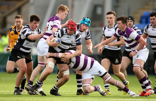 Jack Canning is tackled by Florence McCarthy