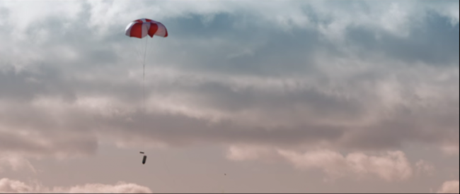 after-snagging-the-drone-in-the-net-a-parachute-is-deployed-to-bring-the-drone-back-to-earth-without-getting-damaged