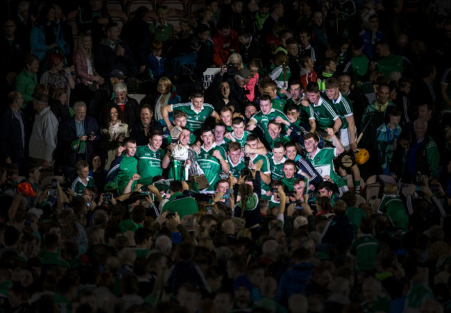 Limerick players celebrate with the trophy