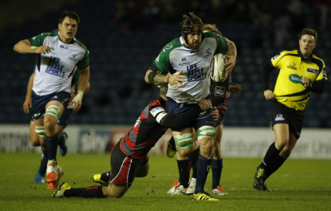 Aly Muldowney tackled by Phil Burleigh