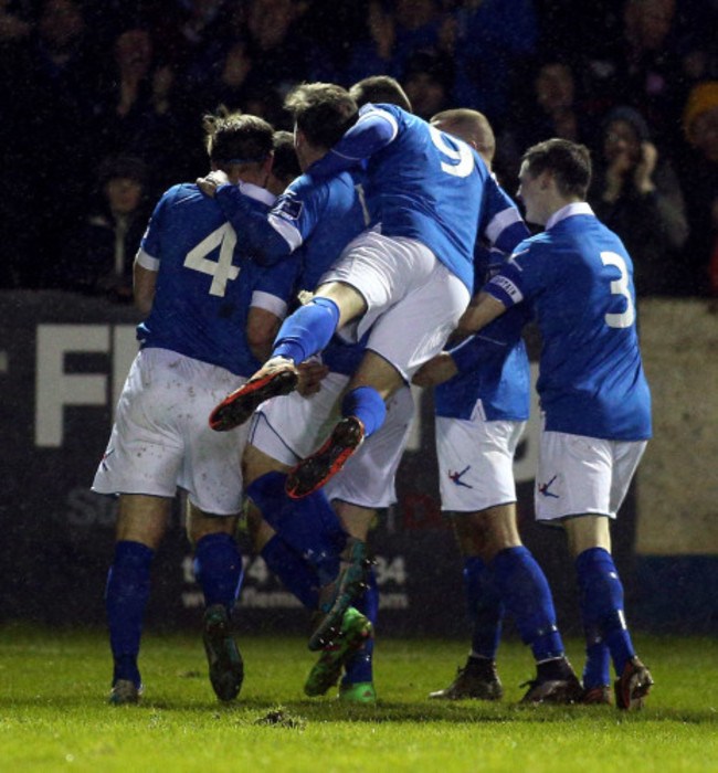 David Scully celebrates scoring with teammates