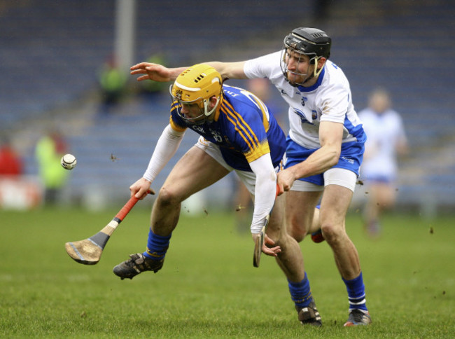 Liam McGrath is tackled by Barry Coughlan