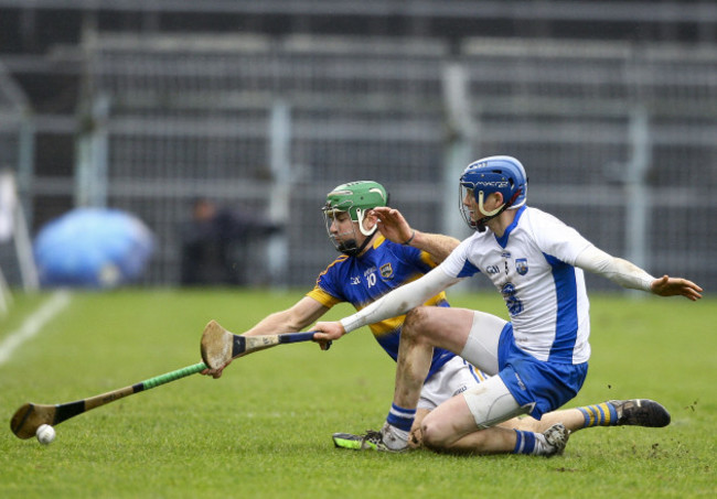 Noel McGrath attempts to keep the ball in play under pressure from Austin Gleeson