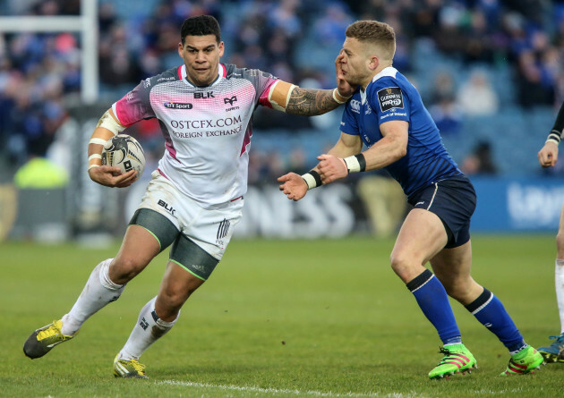 Ian Madigan is handed off by Josh Matavesi