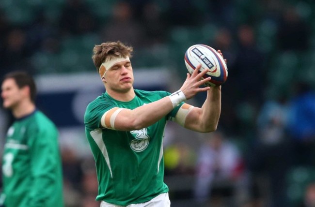 Josh Van der Flier warms up before the match