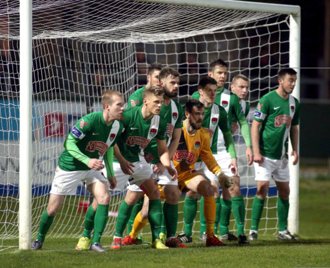 Cork players on the line as they prepare for Derry's free kick inside the box