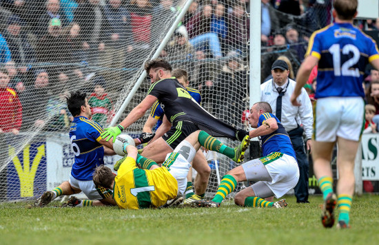 Aidan O'Shea is held back on the goal line by Kieran Donaghy