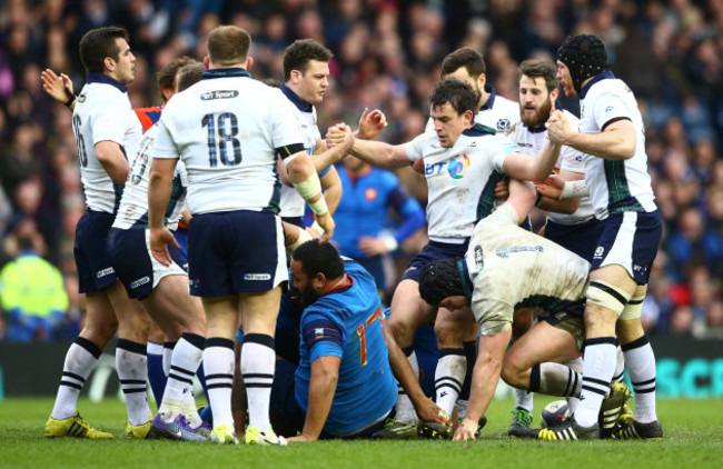 Scotland players help John Hardie to his feet after he won a late penalty