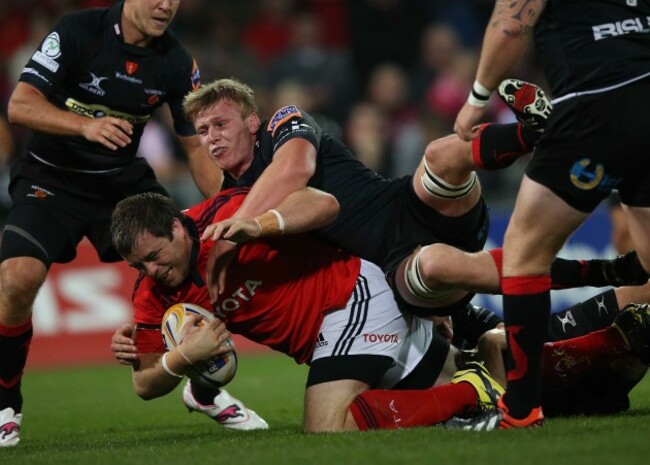 Munster's Marcus Horan tackled by Dragon's Ashley Smith Mandatory Credit &copy;INPHO/Billy Stickland