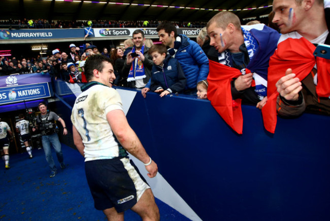 John Hardie jokes with fans after the game