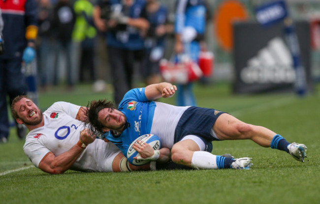 Italy’s Michele Campagnaro is tackled by England’s Chris Robshaw