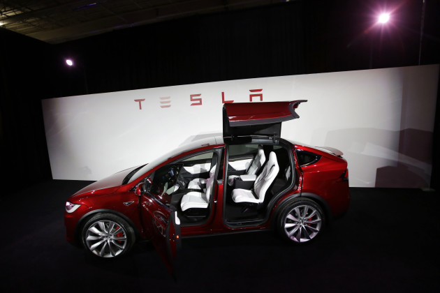 Earns Tesla Motors