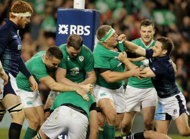 Ireland players congratulate try scorer Devin Toner