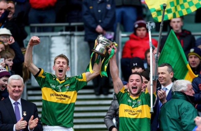 Philip Roche and Ger Aylward lift the cup