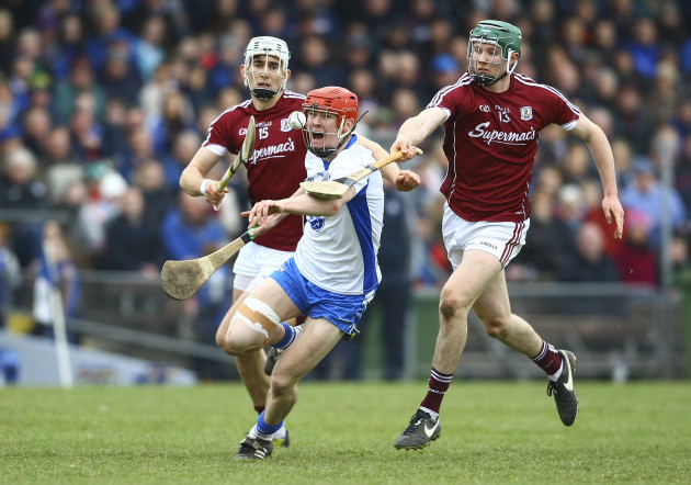 Tadhg de Burca is tackled by Cathal Mannion
