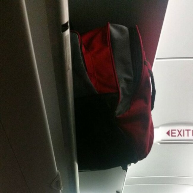 I'm trying to mind my business. #carryons #overheadbins #planes #flights #why