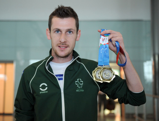 Michael McKillop displays his medal