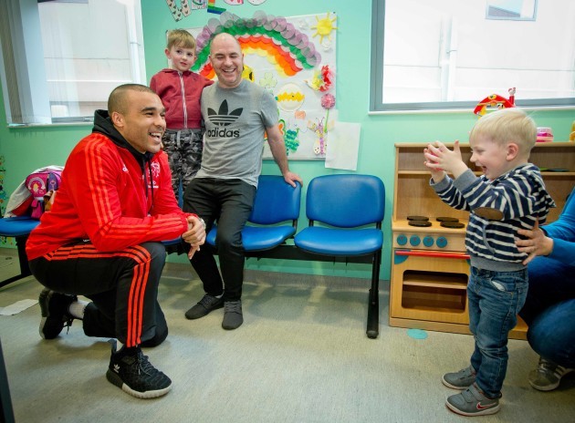 2 year old Ollie Jennings takes a picture of Simon Zebo