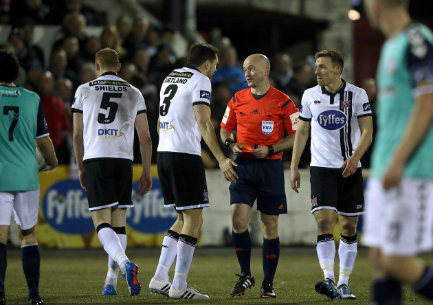 Brian Gartland talks to Padraigh Sutton after Chris Shields was shown a second yellow card