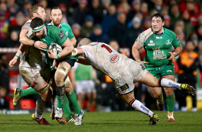 Aly Muldowney tackled by Roger Wilson and Callum Black