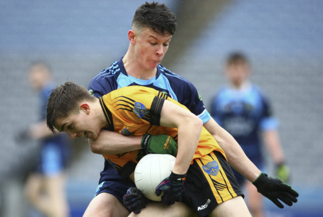 Rory Cunningham is tackled by Luke Gavin