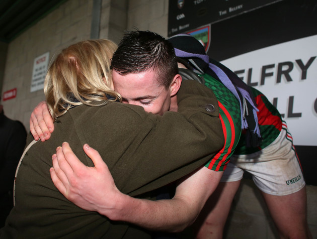 Stephen Coen hugs his mother Mary before he lifts the cup