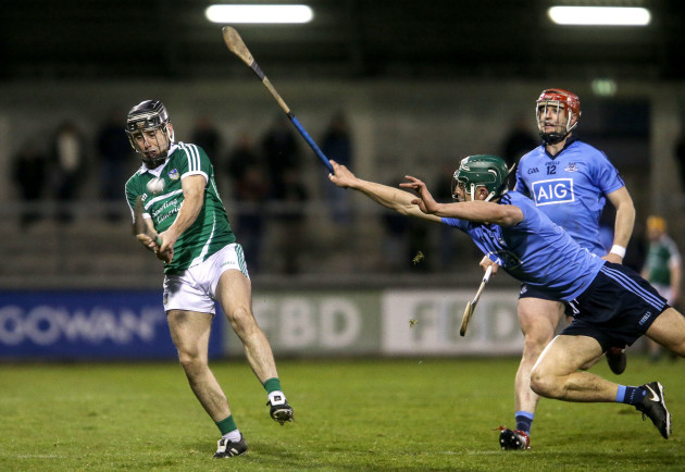 Chris Crummy attempts to block a shot from John Fitzgibbon