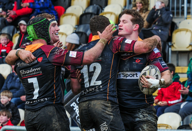 Hallam Amos celebrates scoring his side's second try with teammates