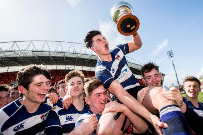 John Hurley lifts the trophy with his team