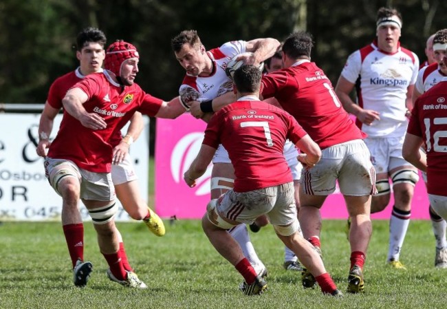 Tommy Bowe under pressure from the Munster defence