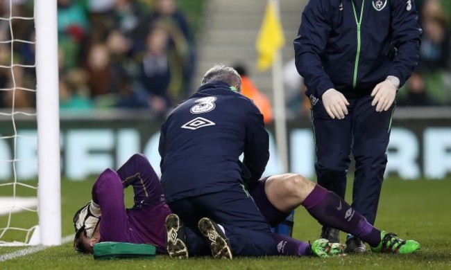 Rob Elliot is treated for an injury before being taken off