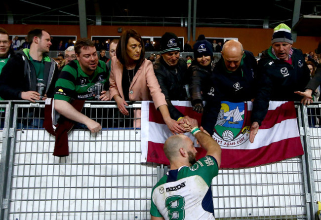 John Muldoon shakes hands with fans after the game