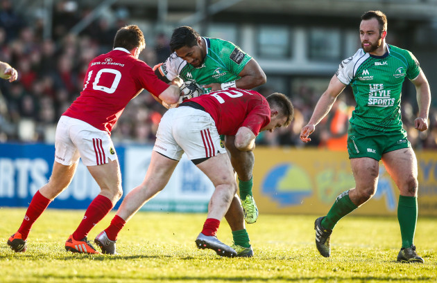 Johnny Holland and Rory Scannell tackle Bundee Aki