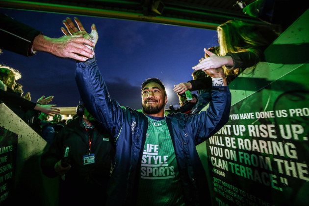 Bundee Aki celebrates with fans at the end of the game