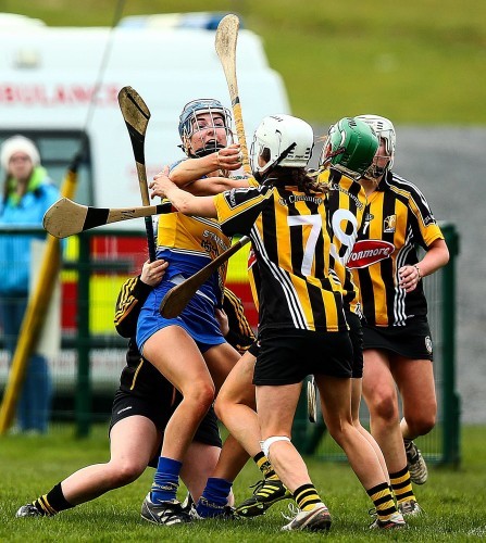 Megan Ryan surrounded by Kilkenny players