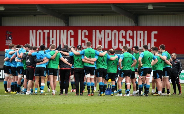 Munster team huddle during training