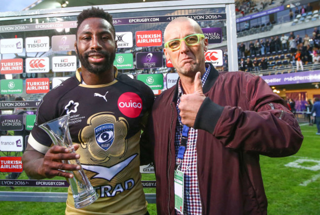 Fulgence Ouedraogo receives the man of the match from Heineken representative Pierre Agostini