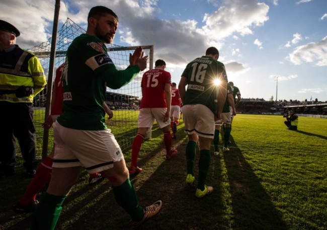 The teams make their way onto the pitch