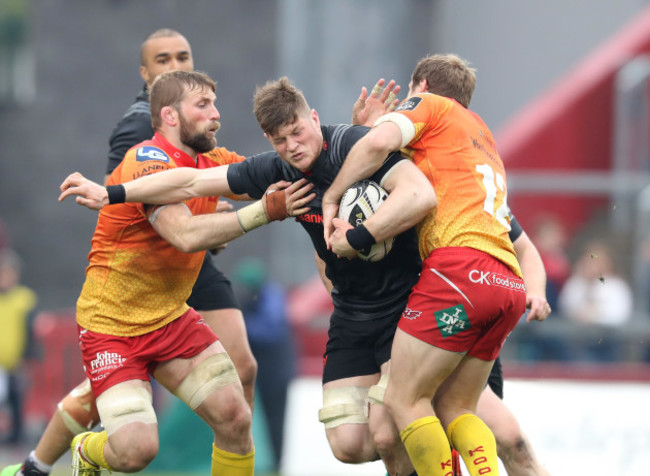 Jack O'Donoghue is tackled by John Barclay and Hadleigh Parkes