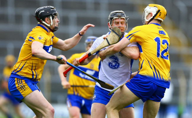 Philip Mahony is tackled by Tony Kelly and Aaron Cunningham