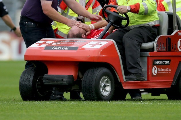 Alan O'Conor leaves the field injured