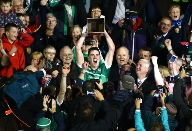 Diarmaid Byrnes lifts the trophy