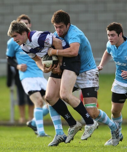 Alan McGinty tackled by Declan Cusack