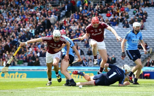 Jason Flynn and Joe Canning battle for a loose ball