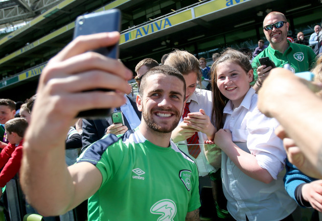 Robbie Brady takes a selfie with a fan