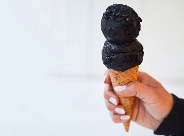 the food section at @mic is finally live and we're kicking things off with a story I did on this very black ice cream from @morgensternsnyc (hand model: @gastrogirls)