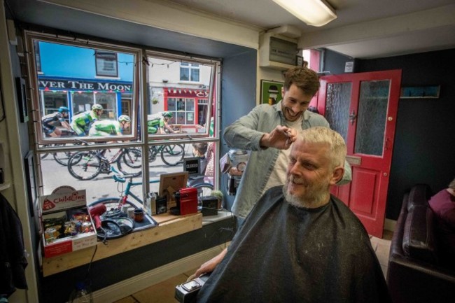 Mike Murphy has his hair cut by Owen Crudge as the An Post Rás finishes in Clonakilty