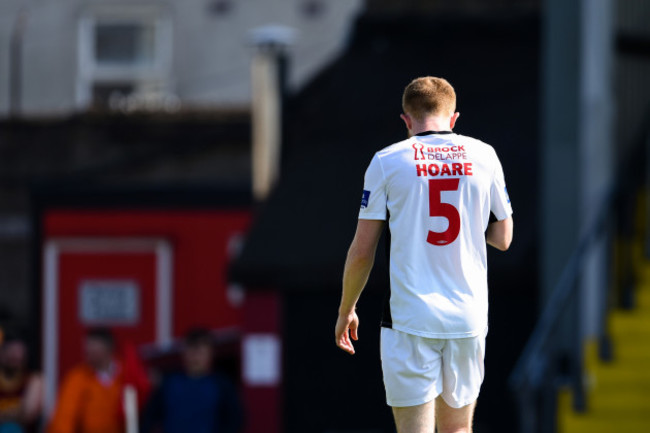 Sean Hoare leaves the field after being sent of