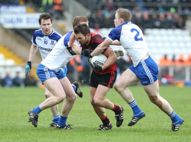 Mark Poland is tackled by Kieran Duffy and Colin Walshe