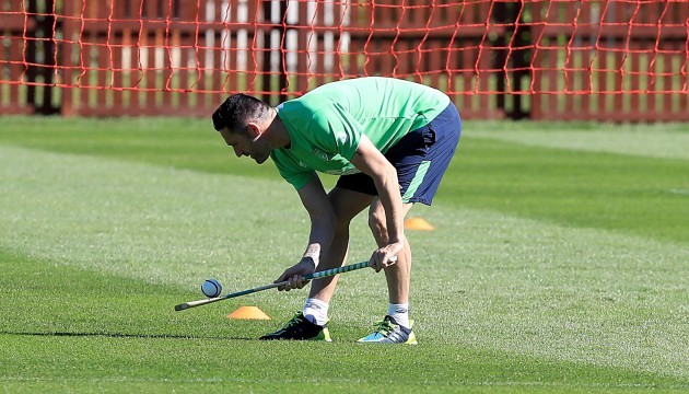 Robbie Keane tries his hand at hurling